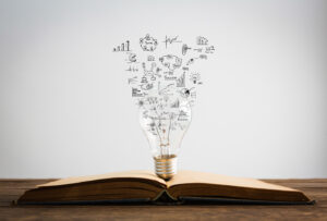 Book and light bulb of business concept
